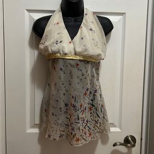 Caren sport sheer cream colored w/ multi colored flower designed halter top.